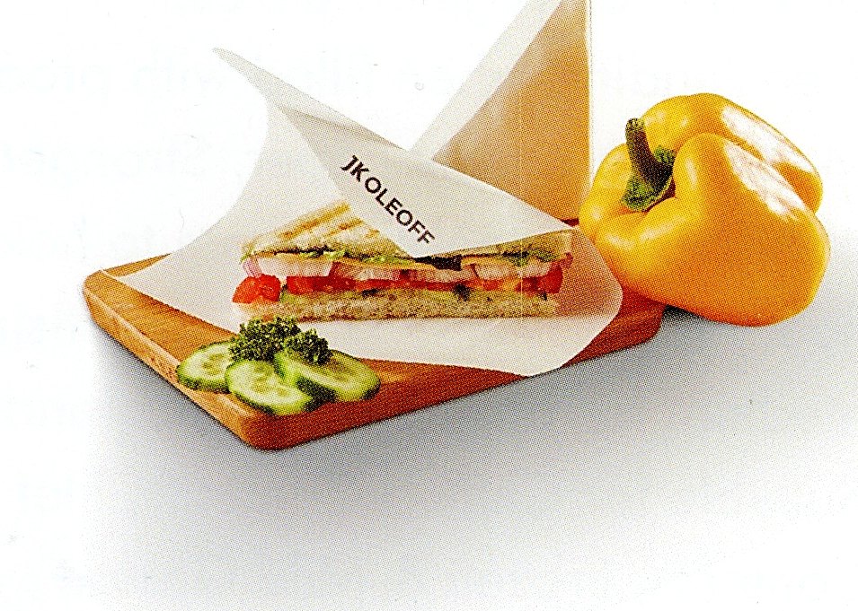 Oil and grease resistant paper wrapping a sandwich